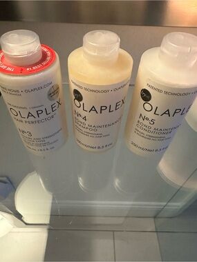 OLAPLEX Trio Hair Care Bottles - White, Cream, Red Accent